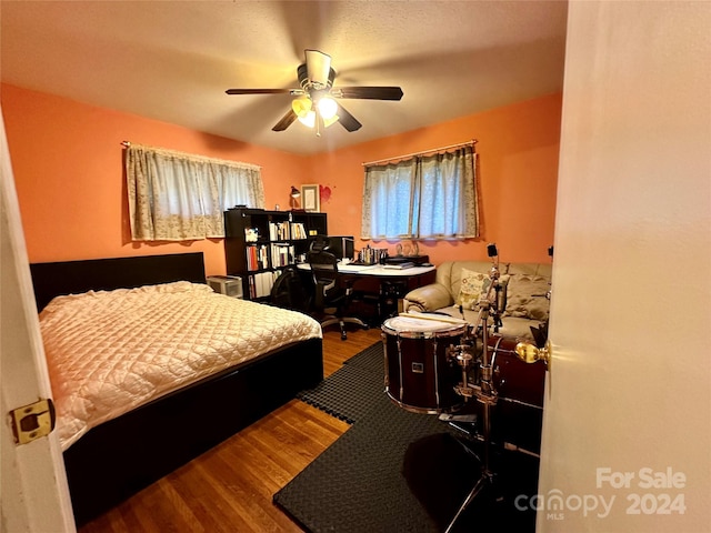 bedroom featuring ceiling fan and hardwood / wood-style flooring