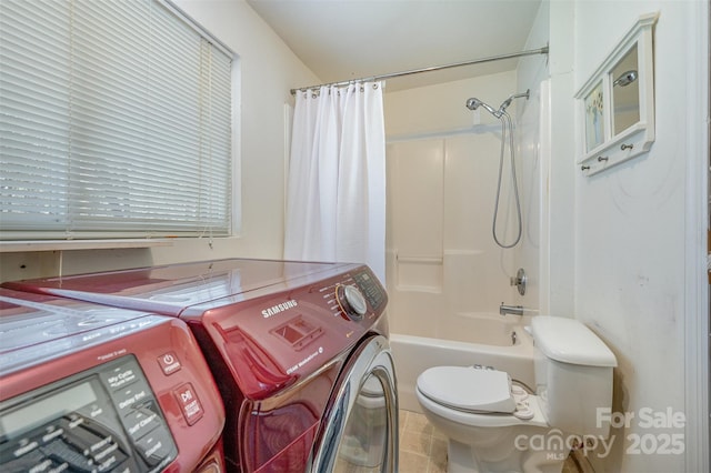 full bath featuring washer and clothes dryer, tub / shower combination, and toilet