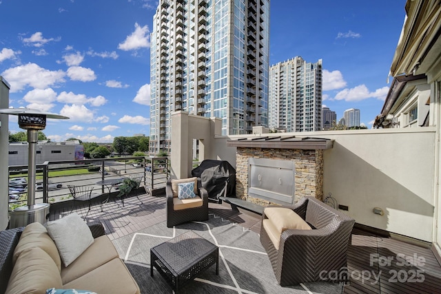 view of patio / terrace featuring a balcony and grilling area