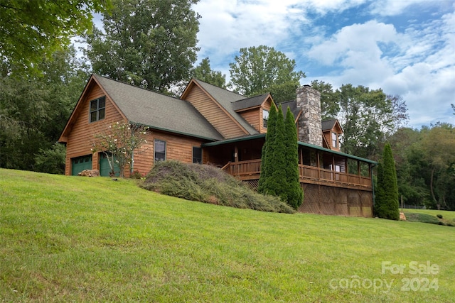 view of side of home with a garage and a yard