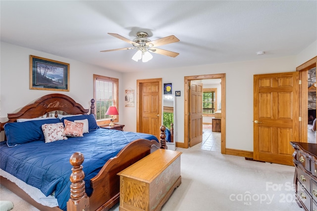 bedroom featuring ceiling fan and light carpet