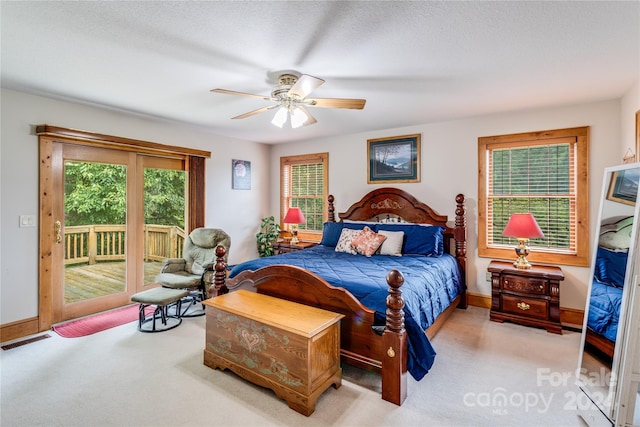 bedroom with ceiling fan, access to outside, and light colored carpet