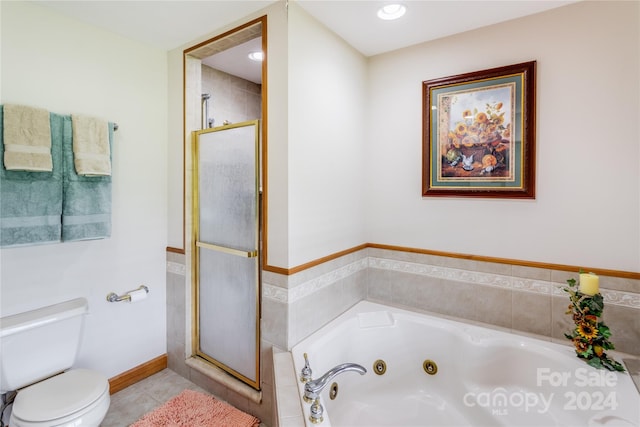 bathroom featuring tile patterned floors, independent shower and bath, and toilet