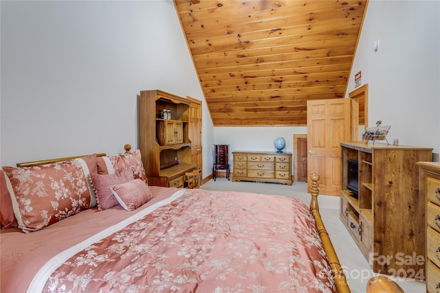 carpeted bedroom featuring lofted ceiling and wooden ceiling