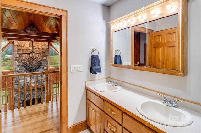 bathroom featuring hardwood / wood-style flooring and double sink vanity