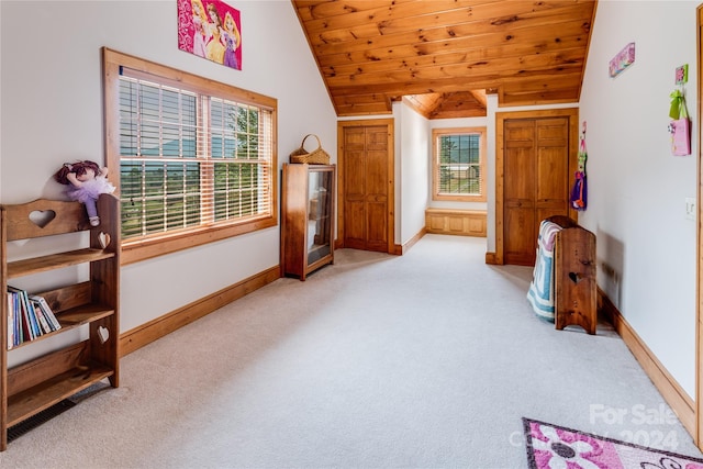 carpeted bedroom with vaulted ceiling and wooden ceiling