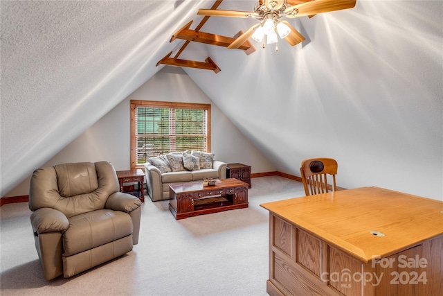 living room with ceiling fan, carpet flooring, lofted ceiling, and a textured ceiling