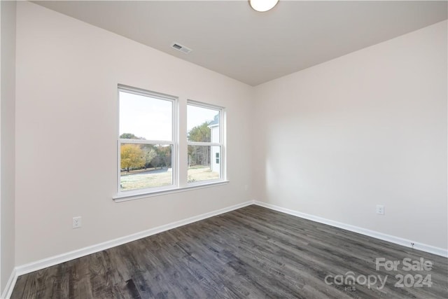 empty room featuring dark hardwood / wood-style floors