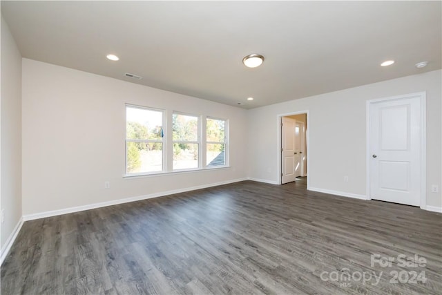 unfurnished room with dark hardwood / wood-style floors