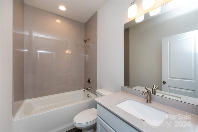 full bathroom featuring vanity, toilet, and tiled shower / bath