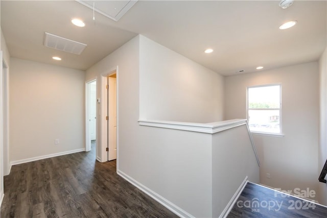 hallway with dark hardwood / wood-style floors