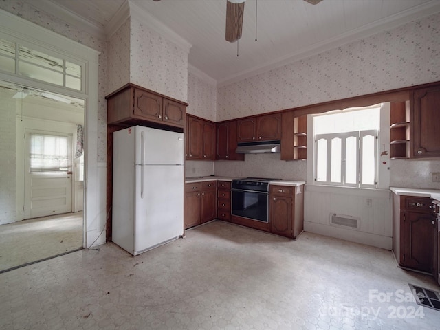 kitchen with open shelves, wallpapered walls, light countertops, and freestanding refrigerator