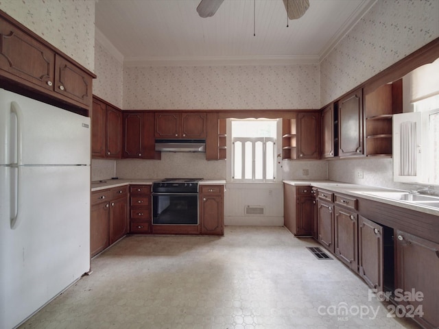 kitchen with wallpapered walls, freestanding refrigerator, light countertops, under cabinet range hood, and open shelves