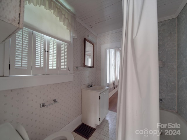 bathroom with crown molding, a tub, vanity, and wallpapered walls