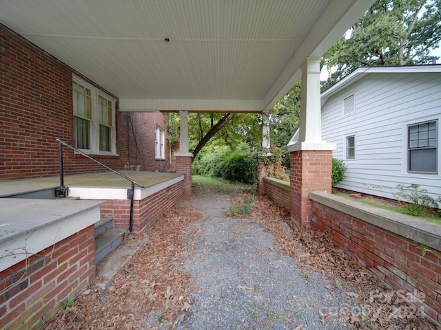 view of patio / terrace featuring driveway and covered porch