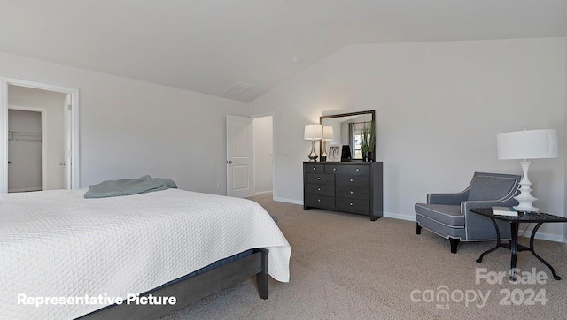 carpeted bedroom with lofted ceiling