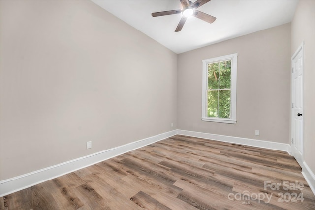 spare room featuring ceiling fan, vaulted ceiling, and hardwood / wood-style floors