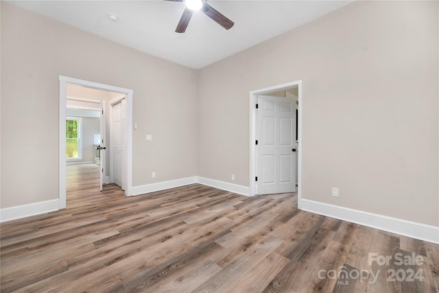 unfurnished room featuring ceiling fan and wood-type flooring