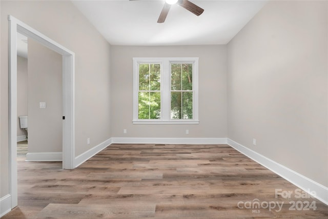 unfurnished room featuring ceiling fan and wood-type flooring