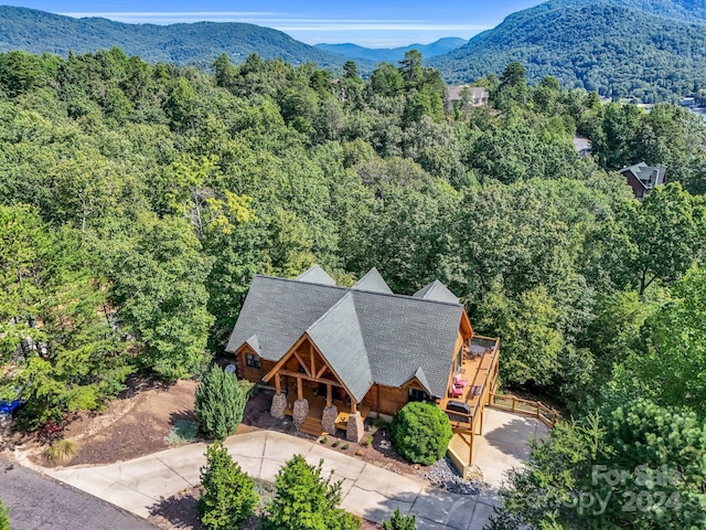 bird's eye view with a mountain view and a view of trees