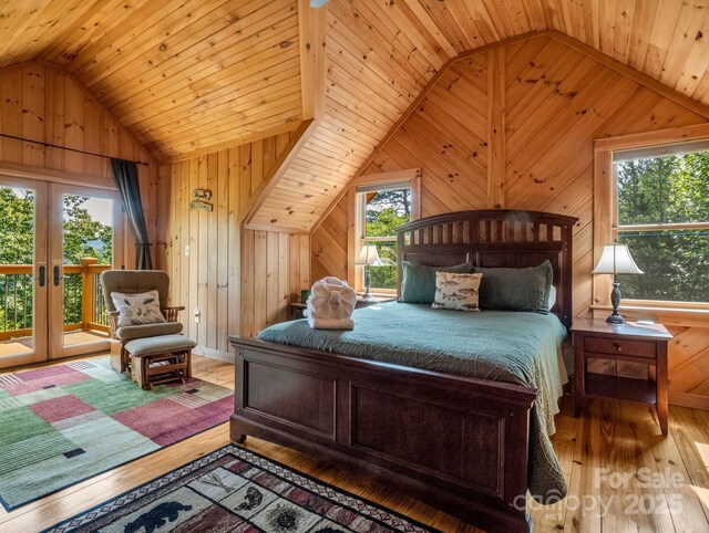 219 Highland Hts, Lake Lure, NC 28746 - bedroom with vaulted ceiling, french doors, access to outside, wooden walls, and wood-type flooring