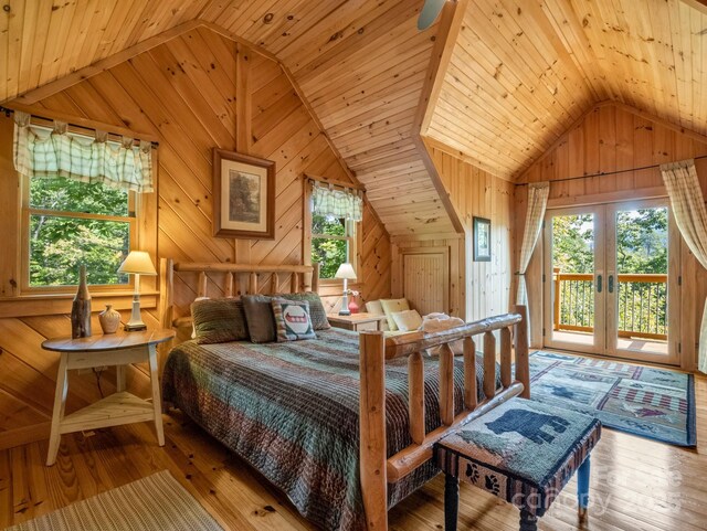 219 Highland Hts, Lake Lure, NC 28746 - bedroom with vaulted ceiling, wood walls, access to exterior, hardwood / wood-style flooring, and wooden ceiling