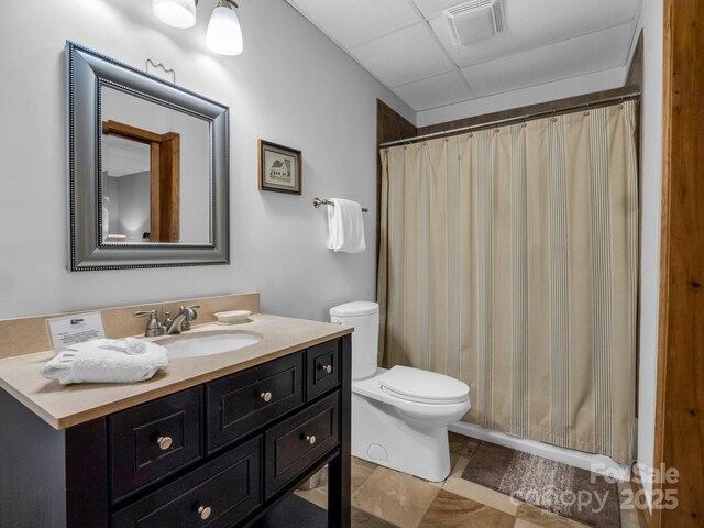 219 Highland Hts, Lake Lure, NC 28746 - full bathroom featuring toilet, vanity, a drop ceiling, tile patterned floors, and a shower with shower curtain