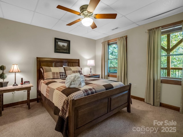 219 Highland Hts, Lake Lure, NC 28746 - bedroom with light carpet, a drop ceiling, multiple windows, baseboards, and ceiling fan