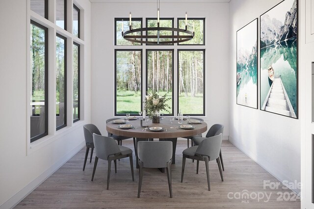 dining area featuring plenty of natural light and light hardwood / wood-style floors