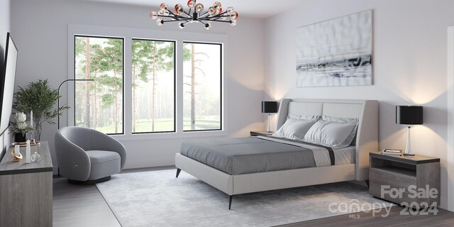 bedroom featuring hardwood / wood-style flooring and multiple windows