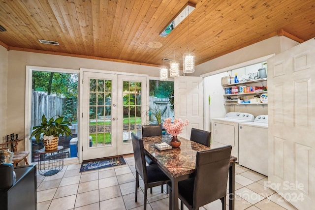 dining space featuring light tile patterned floors, washing machine and clothes dryer, wooden ceiling, and french doors