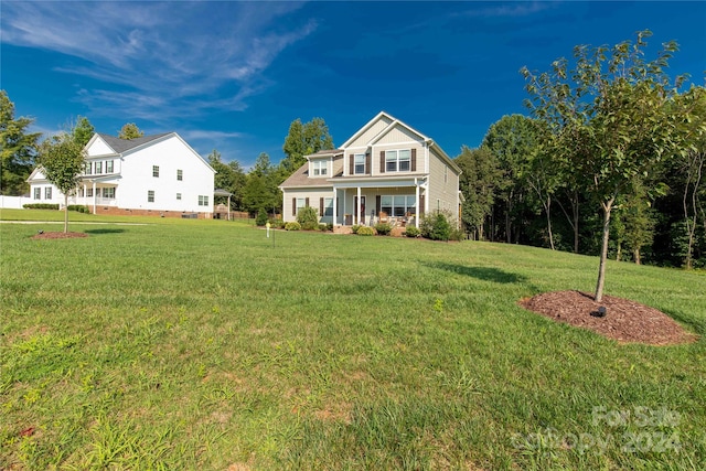 view of front of home with a front lawn