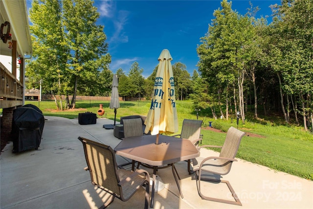 view of patio featuring a grill