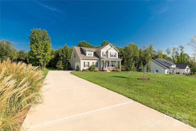 view of front of home with a porch and a front yard