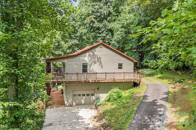 228 Barefoot Cv, Burnsville, NC 28714 - view of home's exterior featuring a garage and a deck