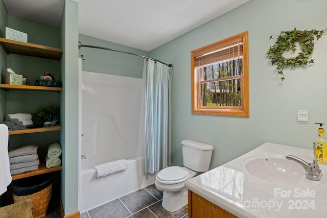 full bathroom featuring vanity, tile patterned floors, toilet, and shower / bath combo