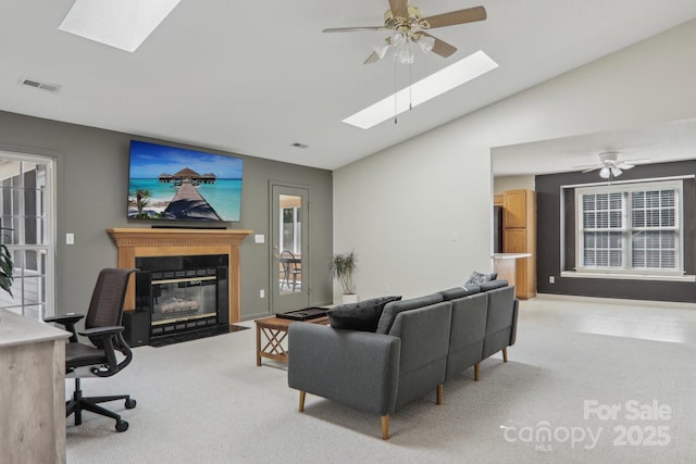 living room with lofted ceiling, light carpet, and ceiling fan