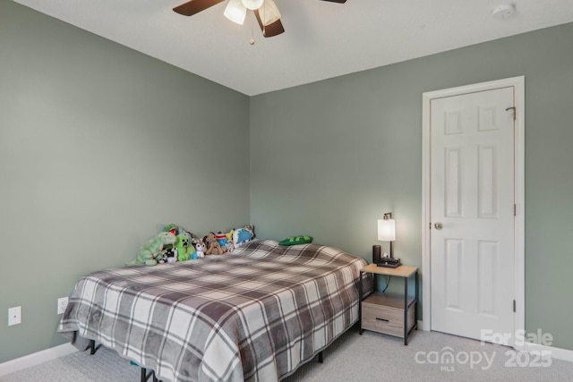 carpeted bedroom featuring ceiling fan