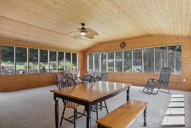 sunroom / solarium with ceiling fan, wood ceiling, and vaulted ceiling