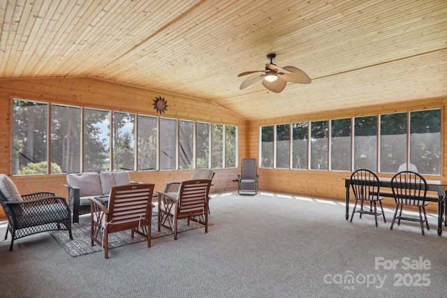 sunroom / solarium with ceiling fan, wood ceiling, and vaulted ceiling