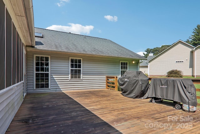 wooden terrace with grilling area