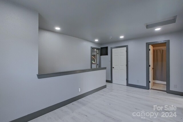 empty room with light wood-type flooring