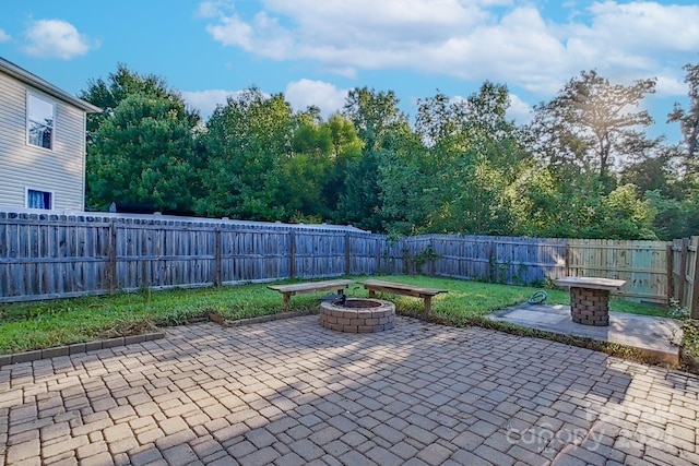 view of patio / terrace with an outdoor fire pit