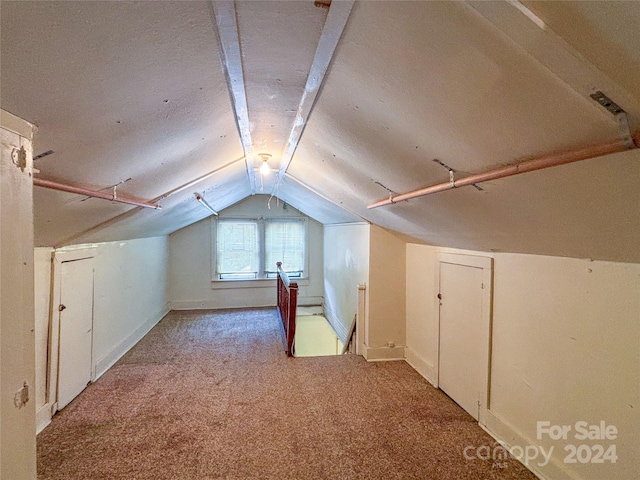 bonus room featuring carpet and lofted ceiling