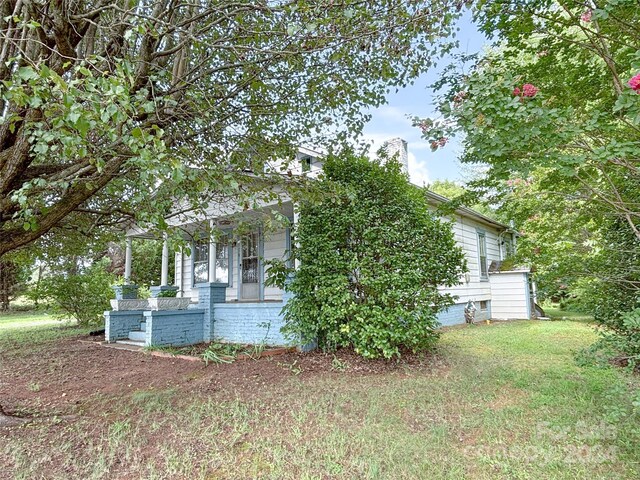 view of property exterior featuring a yard