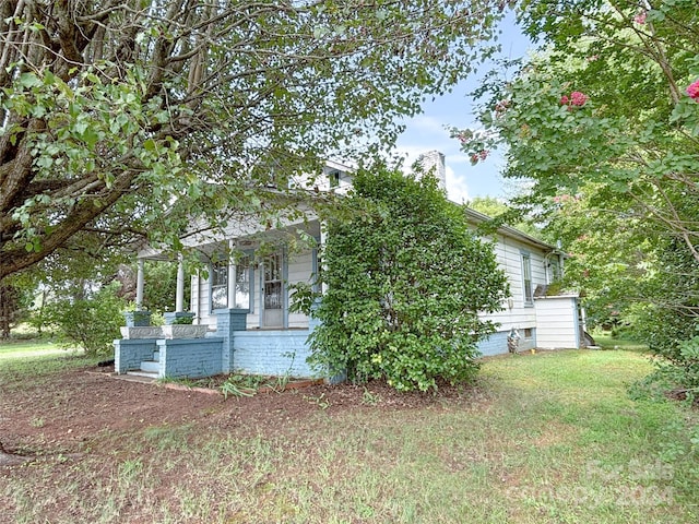 view of home's exterior with a yard