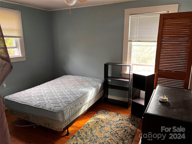 bedroom featuring wood finished floors