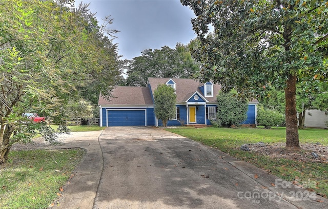 cape cod-style house with a front lawn and a garage