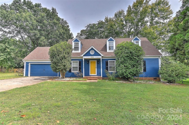 cape cod home with a garage and a front yard