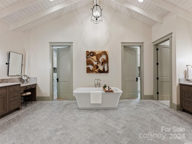 bathroom featuring beamed ceiling, high vaulted ceiling, a bathing tub, and vanity